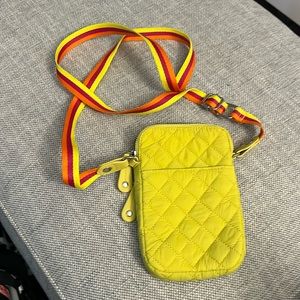 Sondra Roberts yellow crossbody mini bag with outer pocket.